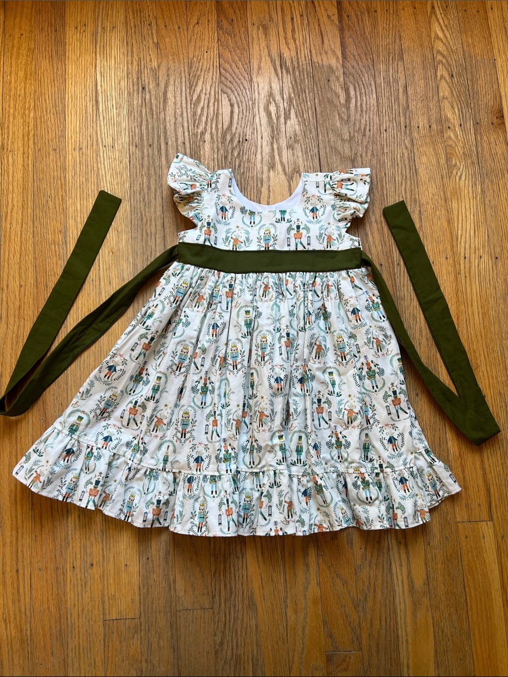 Girls' White Nutcracker-Print Dress with Olive Sash